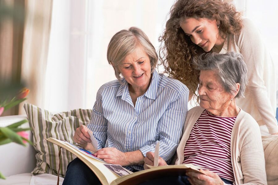 A teenage girl, mother and grandmother at home.