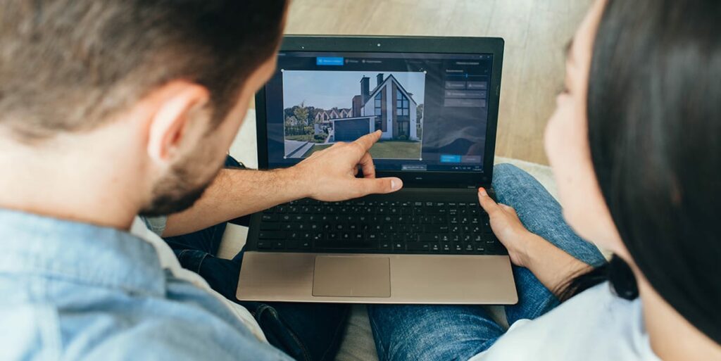 couple browsing online to buy their dream home